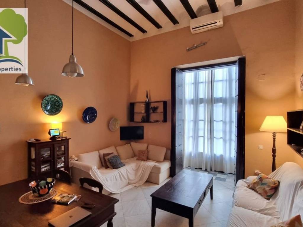 Living Room with high timber beam ceiling